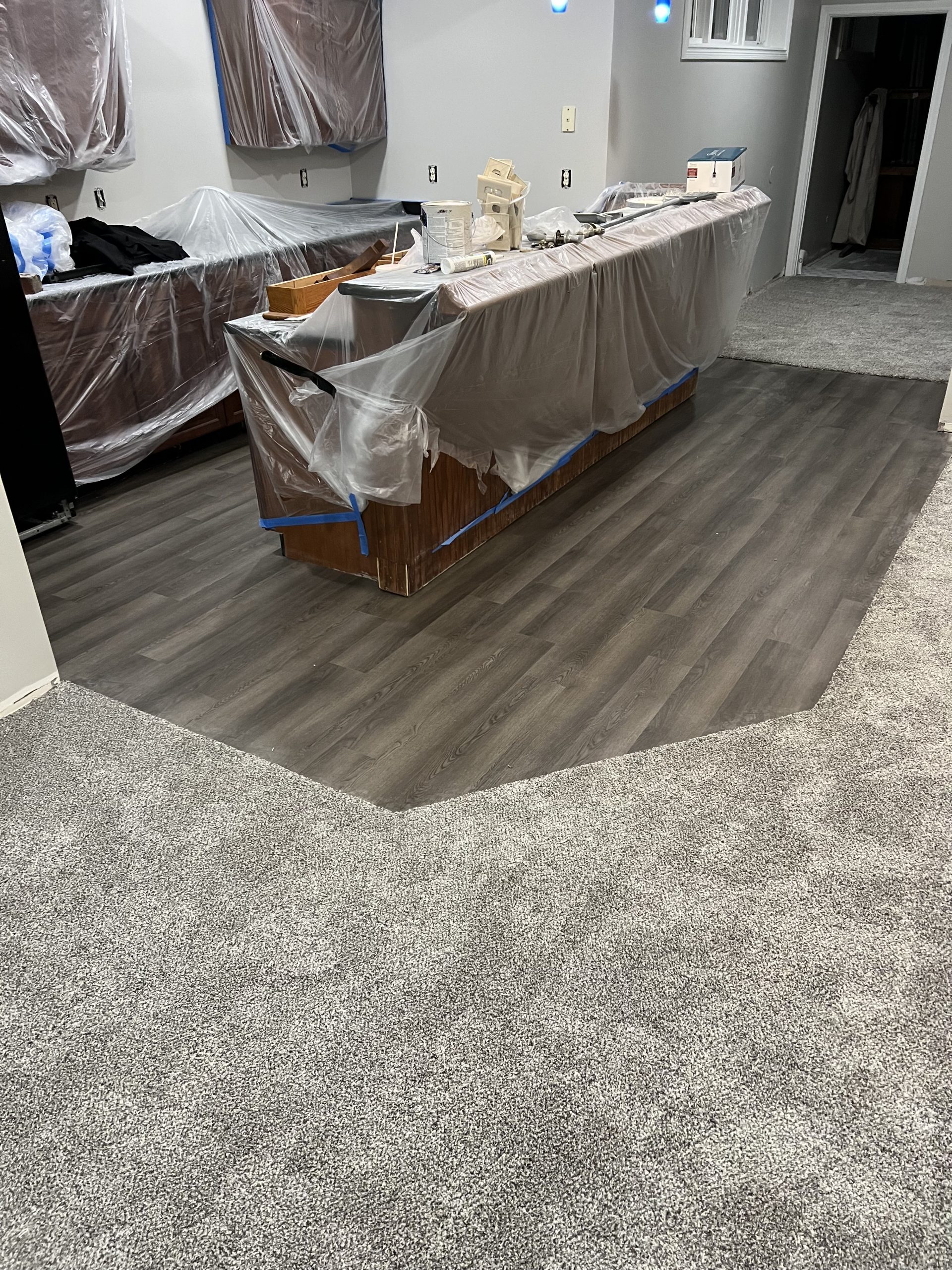 vinyl-plank-carpet-transition-basement-bar