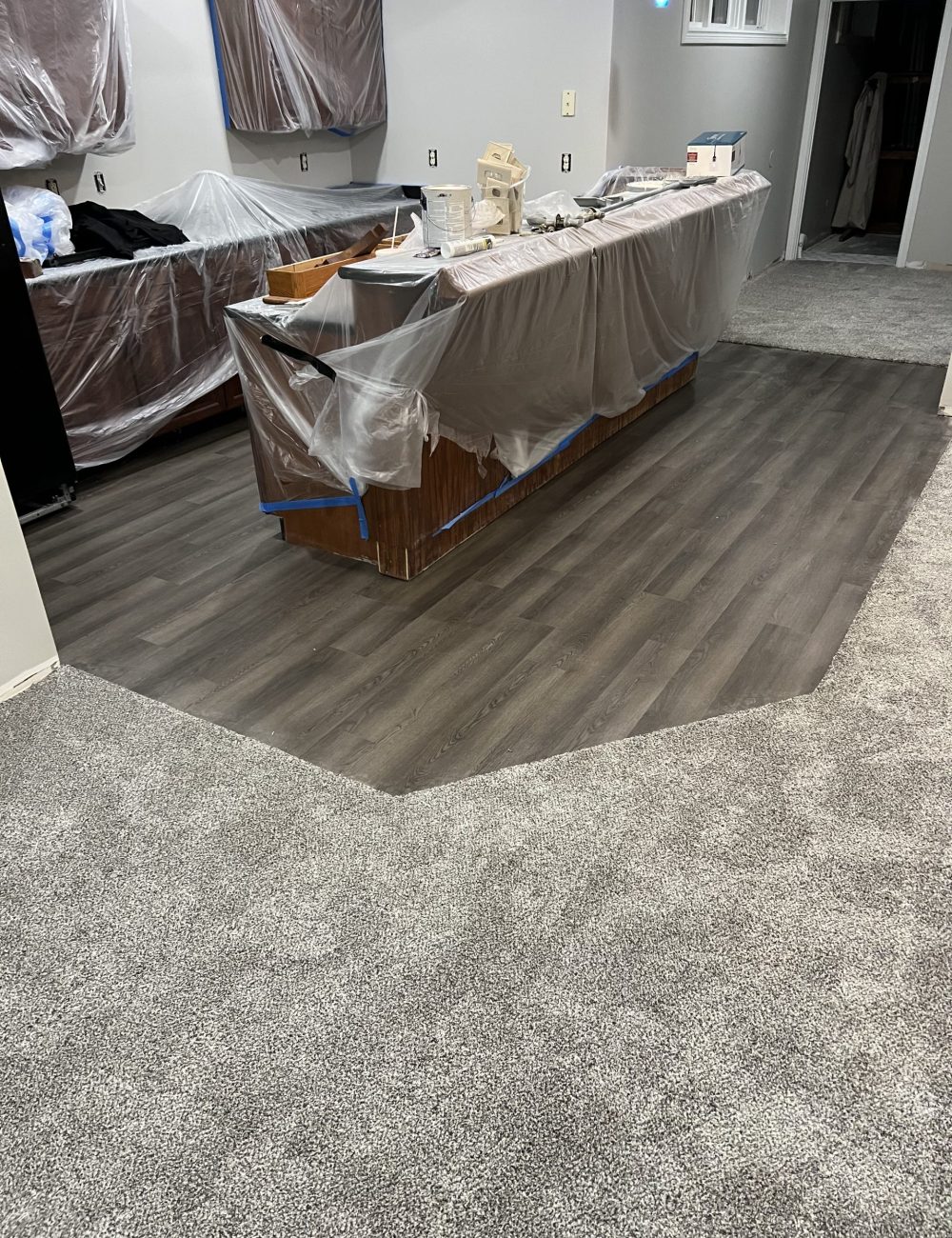 vinyl-plank-carpet-transition-basement-bar